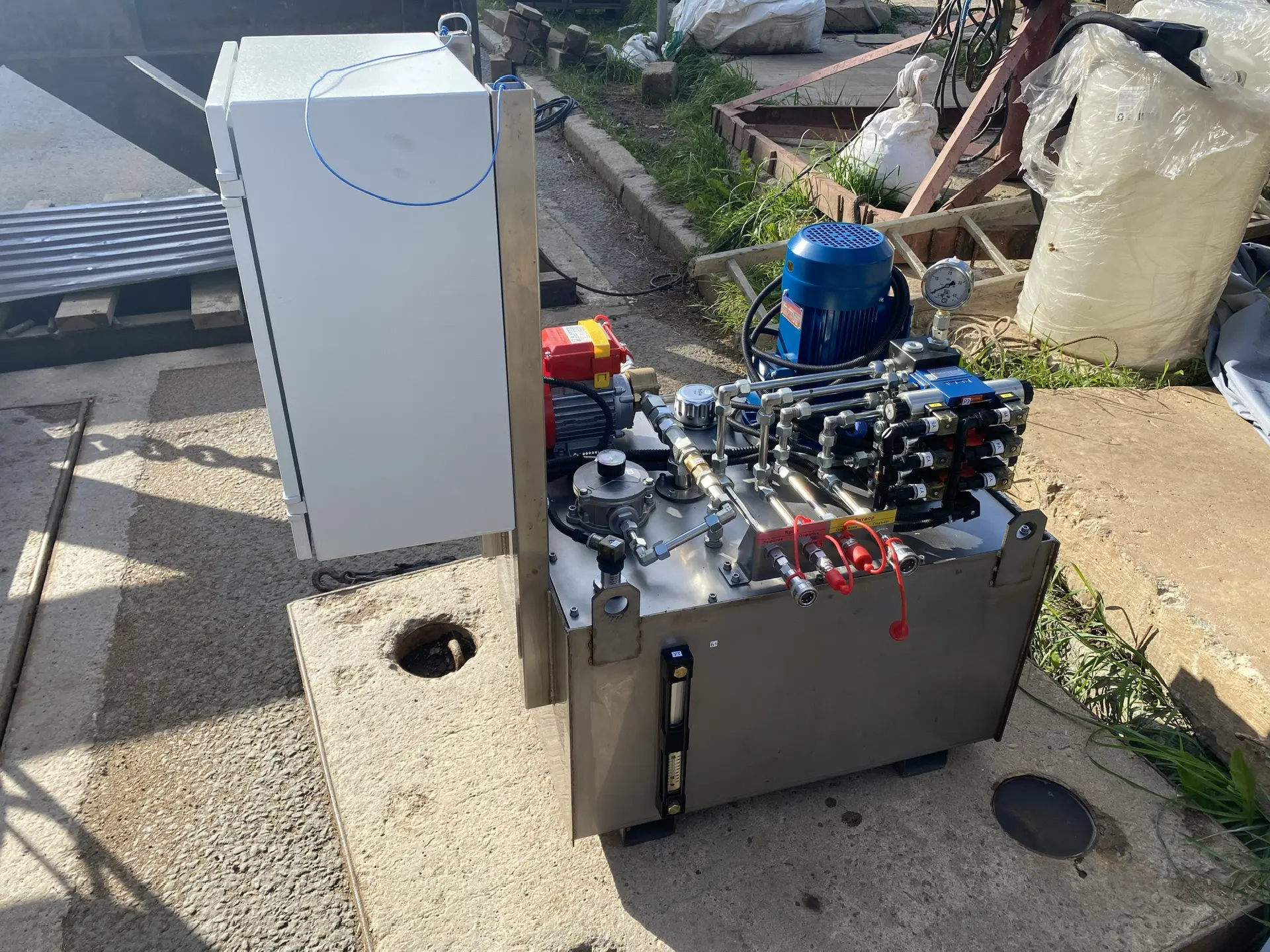 Compact portable hydraulic pump station on a frame with oil tank and electric motor